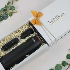 A beautifully arranged tech gift box containing an insulated travel tumbler, high-capacity USB drive, and a compact tech organizer, ideal for gifting.