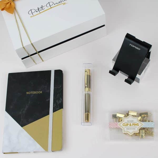 Elegant office gift box with notebook, gold pen, phone stand, and gold clips