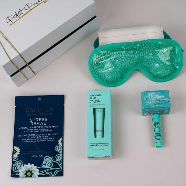 Contents of the get well soon gift box displayed outside the box, including a stress relief facial mask, collagen eye cream, hydrating face cream, coconut lip balm, and a cooling gel eye mask, ideal for gifting.