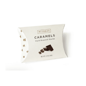 McCrea’s Caramels Dark Roasted Mocha flavor in elegant cream pillow box packaging with coffee bean and chocolate visuals