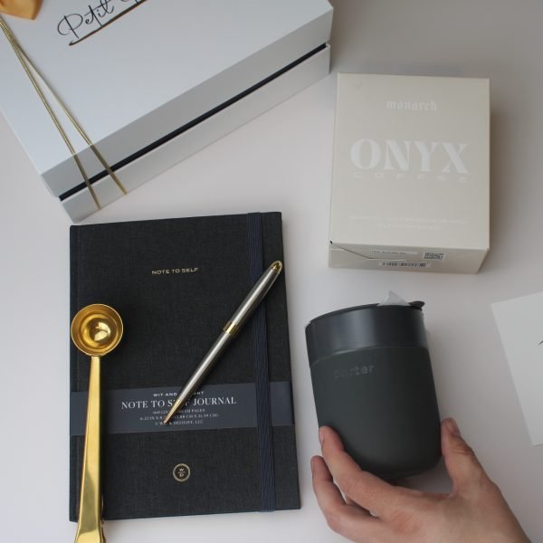 “Start with Intention” Gift Box – Coffee, Clarity & Purpose 7 Faith-based gift box flat lay with journal, Onyx coffee, ceramic mug, and gold coffee scoop – Petit Pressie gift box for her